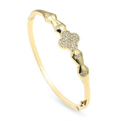 Dzebonde gold four leaf clover crystal bangle bracelet with elegant polished finish.