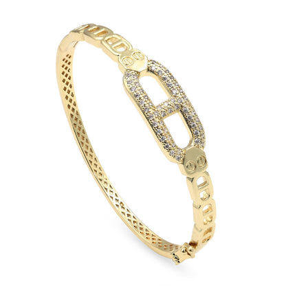 Dzebonde gold pavé link bangle bracelet with sparkling crystal accents and modern luxury design.