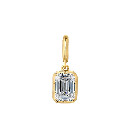 A gold pendant featuring an emerald-cut clear gemstone in a gold bezel setting, suspended from a gold bail, shown against a plain white background.