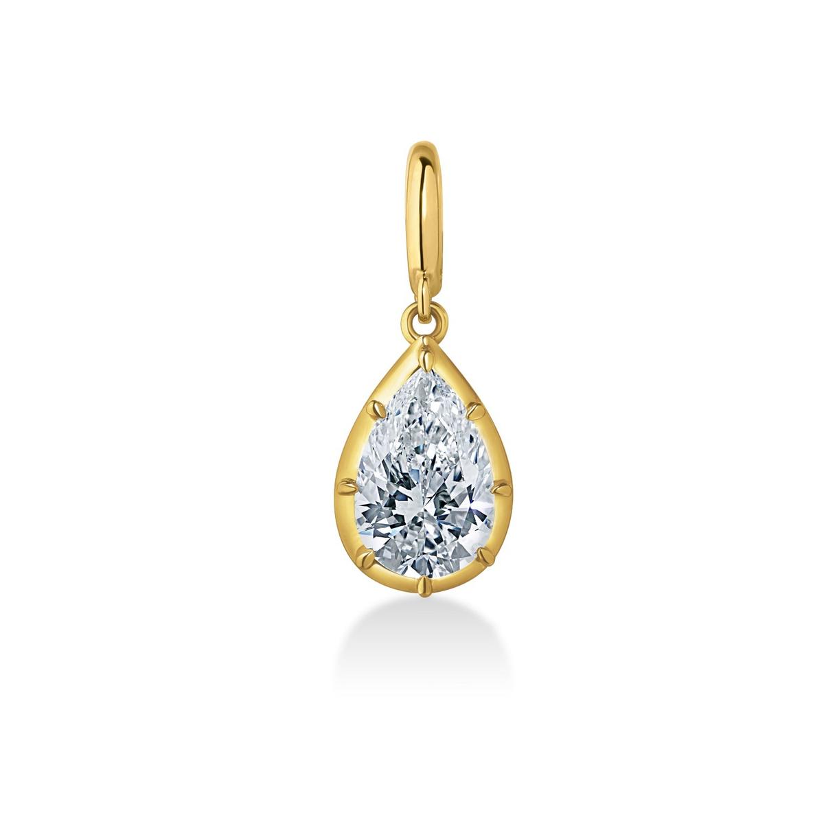 A gold teardrop pendant featuring a clear pear-cut diamond, set against a plain white background with a soft reflection below.