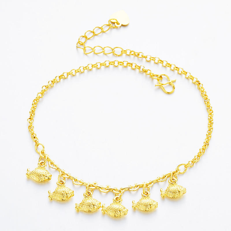 A gold chain anklet featuring five textured fish charms dangling from the front, displayed on a clean white background.